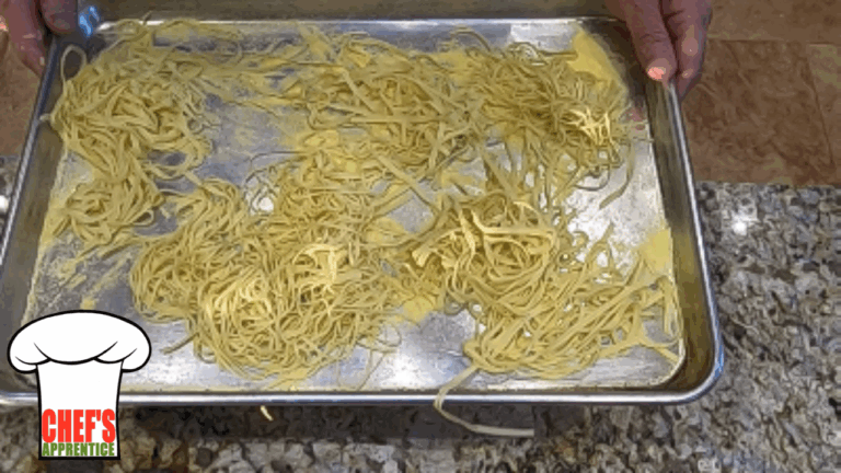 a sheet pan with hand-made pasta dusted with flour