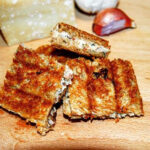 photo of mini grilled ham and cheese sandwiches artistically arranged
