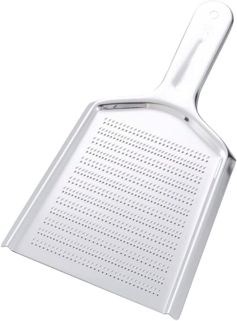 photo of a metal grater called and oroshigane in Japanese, made for grating fresh wasabi root or ginger root