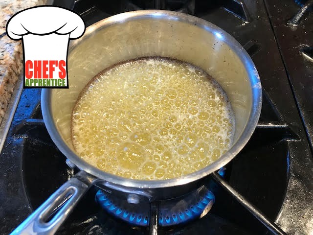 a sauce pan with hot melted butter