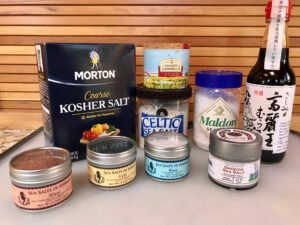 photo of a collection of different kinds of salt and salt enhancers