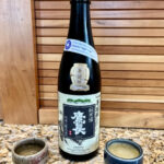 bottle of Bodaimoto sake with two ochoko sake cups