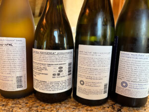 photo of the back label of several sake bottles
