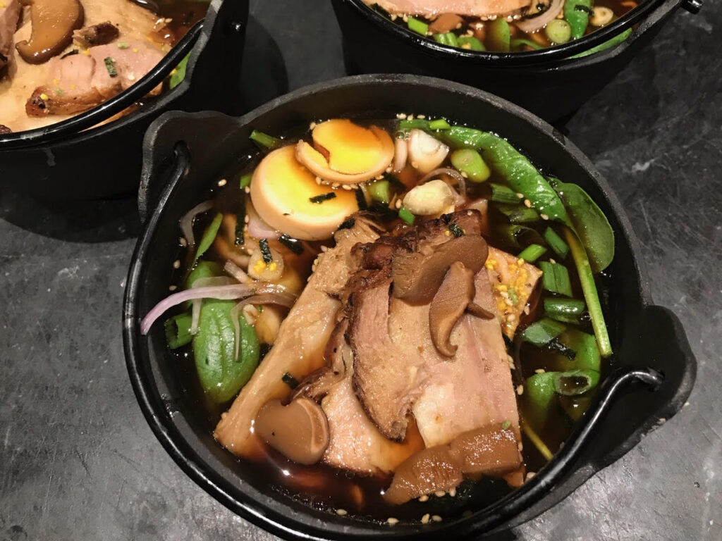 bowl of scratch-made ramen noodles with broth, chasu pork, and vegetables