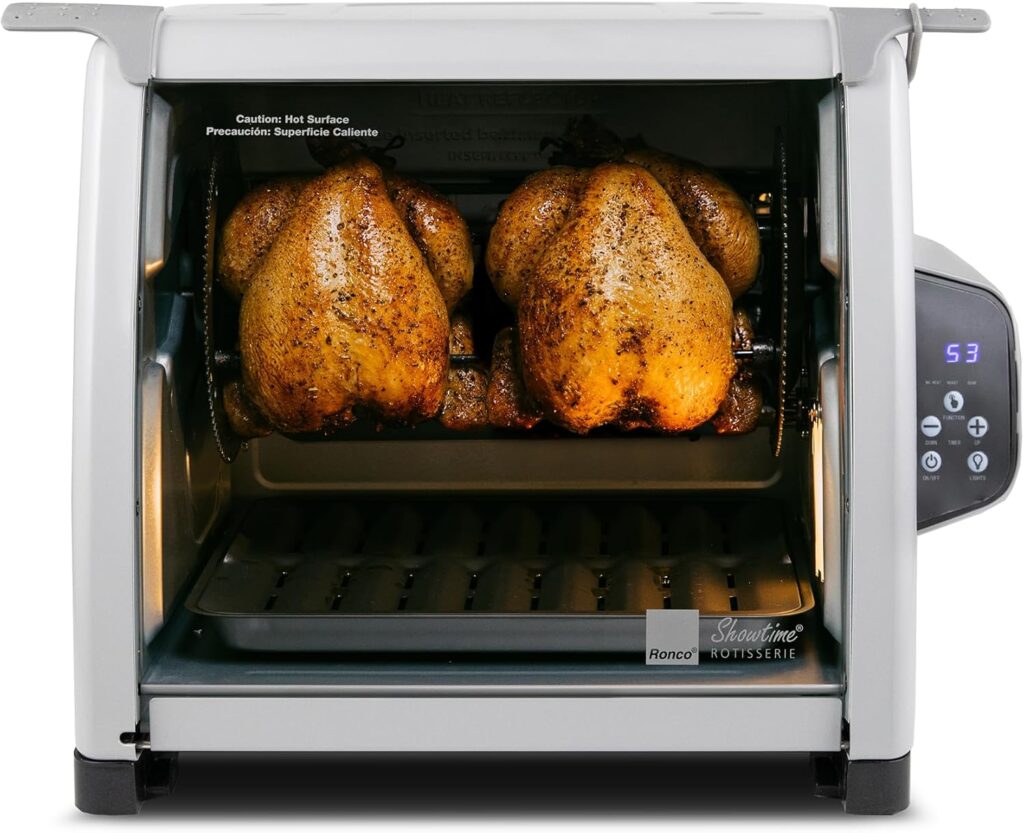 Ronco brand rotisserie oven with two roasting chickens