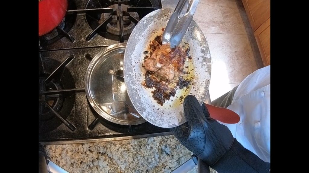 roasted chicken thigh on a sizzle plate
