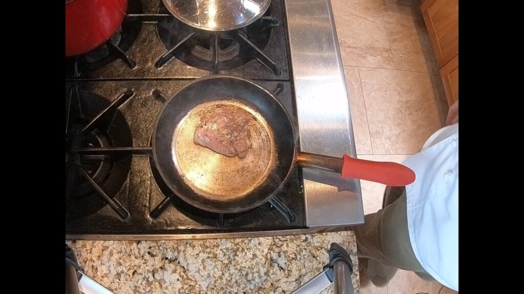 chicken thigh roasting in a pan