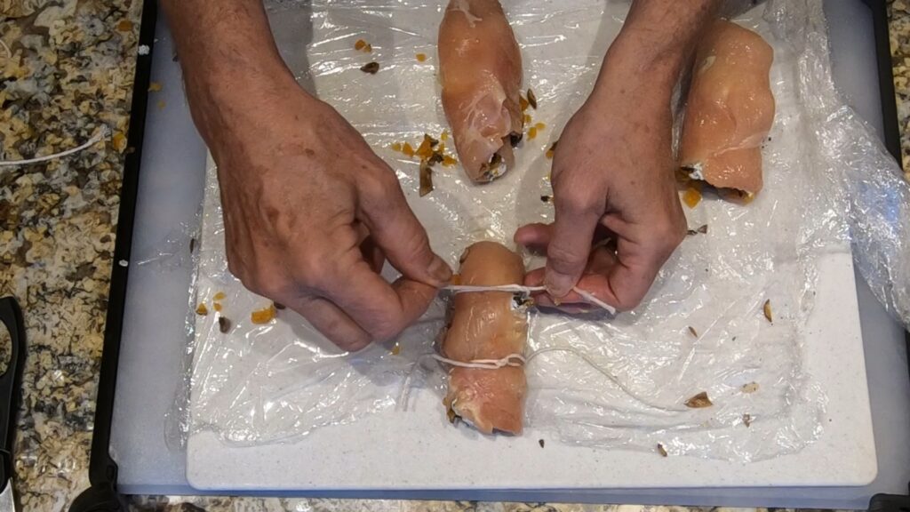 tieing chicken roulade rollups with kitchen string