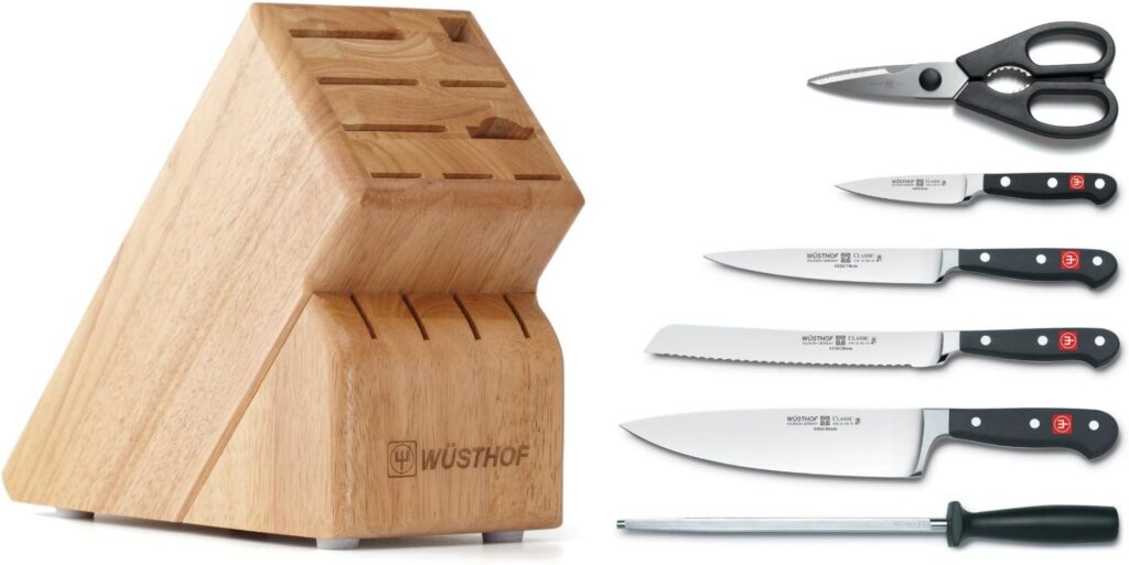 Set of Wusthof brand cooking knives, sharpening steel, and scissors, with knife block