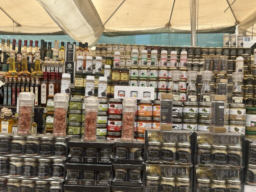 displays of Truffles, Balsamic vinegar, Olive oil, and other products at the Campo de' Fiori market in Rome Italy