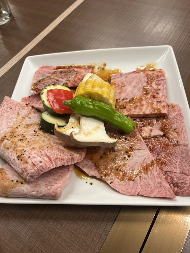 a plate of highly marbled uncooked Wagyu beef