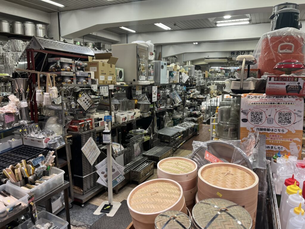 looking inside a kitchen equipment store on Sennichimae Doguyasuji Shotengai, also known as "Kitchenware Street", in Osaka Japan