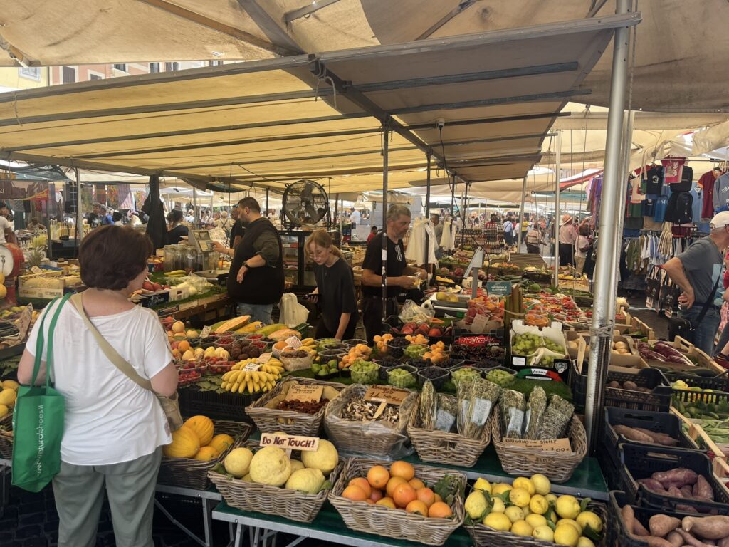 displays of fruits and vegetables at the Campo de' Fiori market in Rome Italy