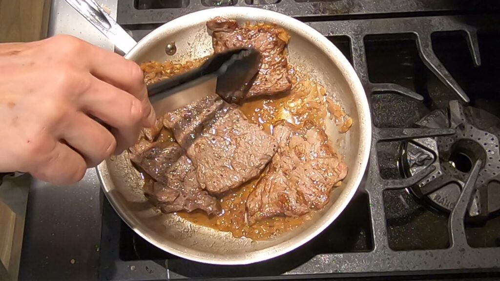 browned beef medallions in a saute pan
