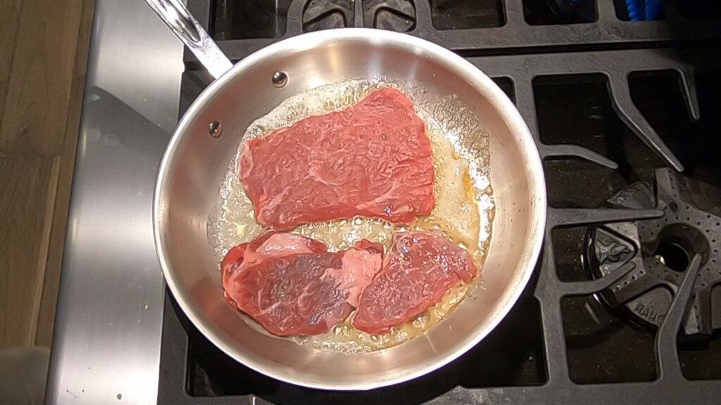 cooking beef medallions in butter in a saute pan