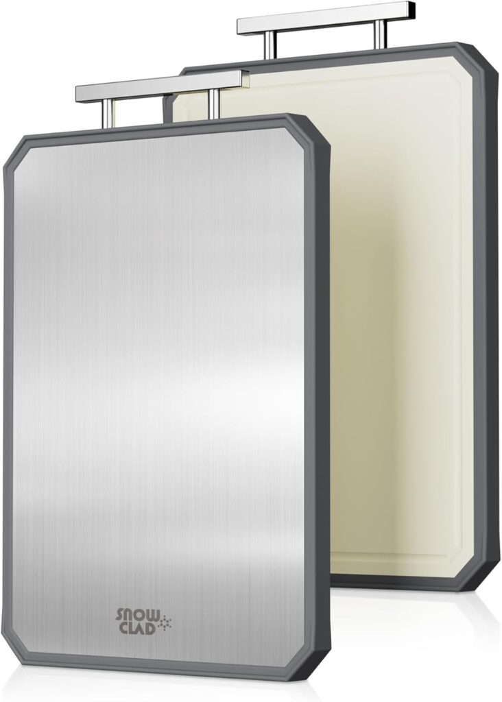 two stainless steel cutting boards with handles