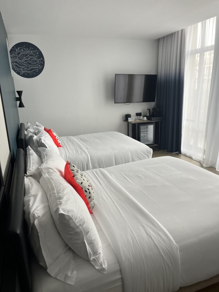 hotel room with two large beds