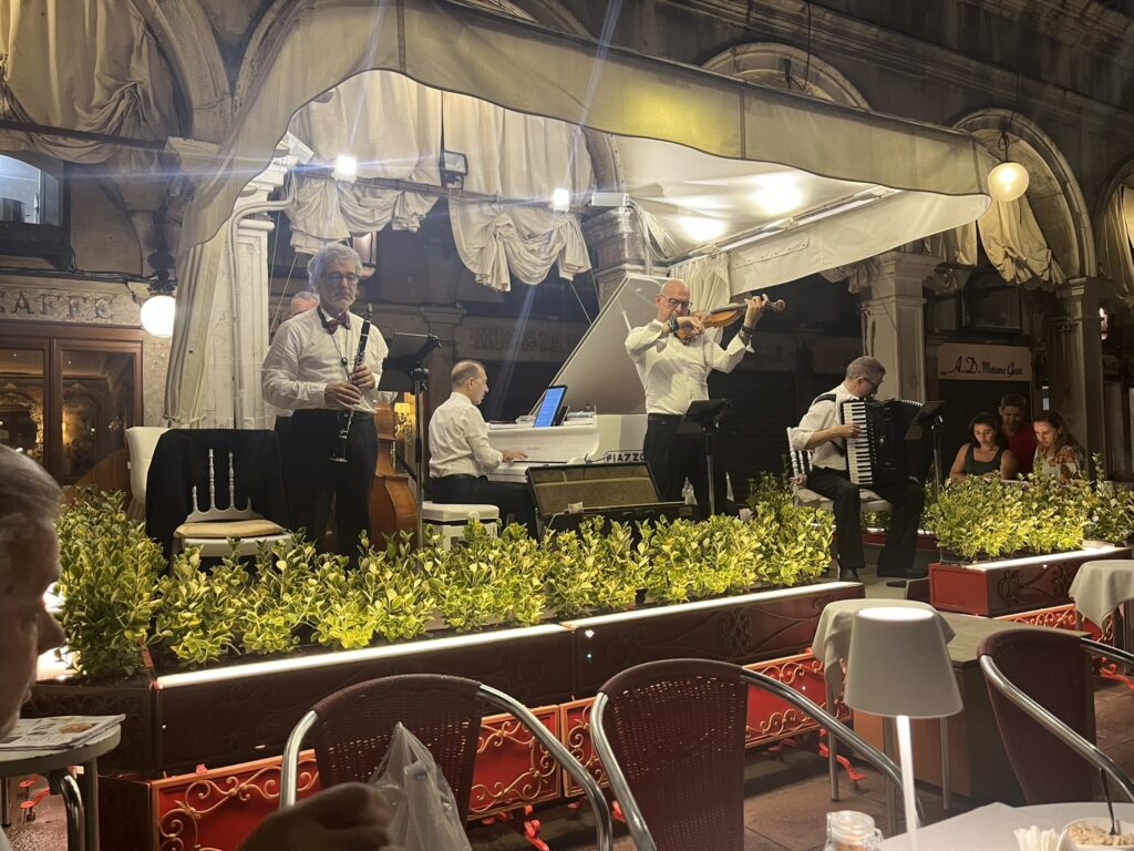 musicians playing at Caffe Quadri in Venice