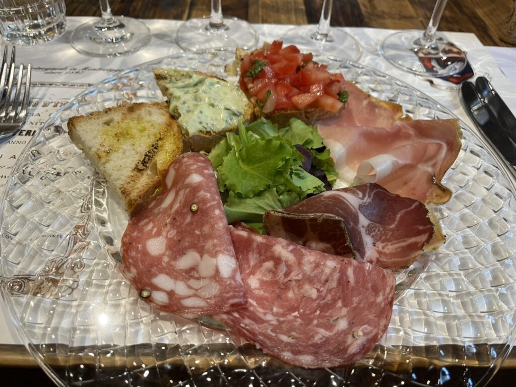 bruschetta trio (sliced bread with tomato, sliced bread with a fantastic arugula sauce, and sliced bread with house-made olive oil)