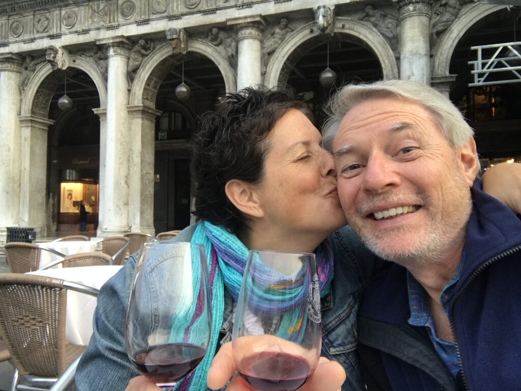 two people with wine glasses at Caffe Florian in Venice