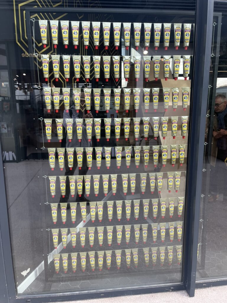 a display of mustard tubes at at Cité Internationale de la Gastronomie et du Vin in Dijon France