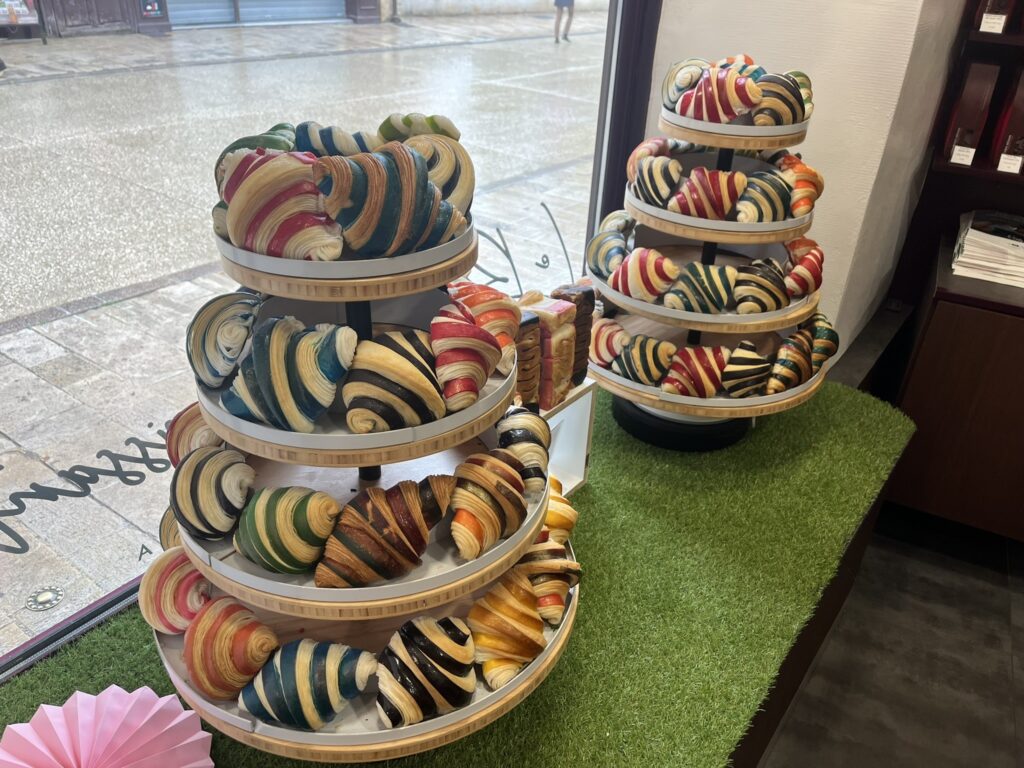 a display of multi-colored croissants
