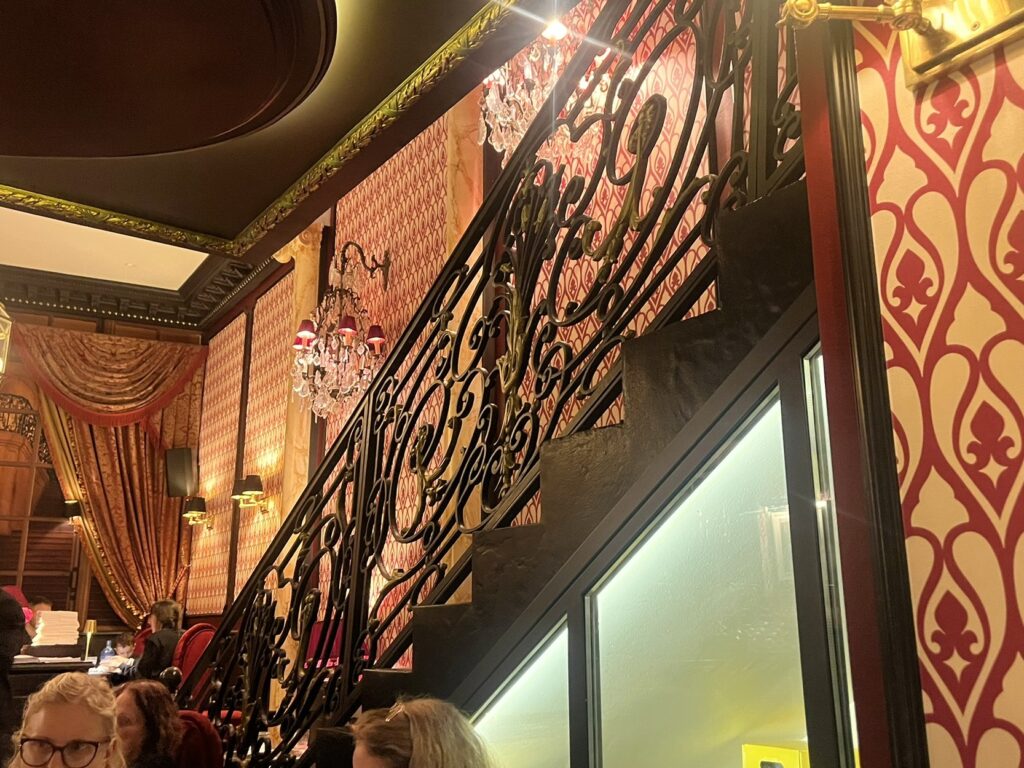 ornate stairway at Speakeasy restaurant in Dijon France