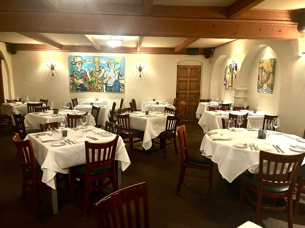 dining room and art paintings at Toma restaurant Santa Barbara California