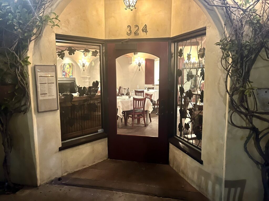 front entrance and dining room as seen through the door of Toma Restaurant Santa Barbara California
