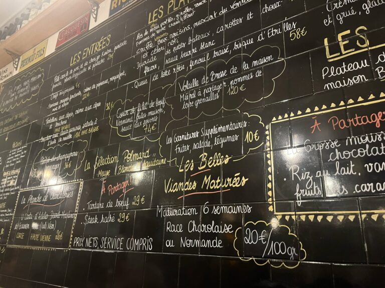 a menu board in a Paris bistro