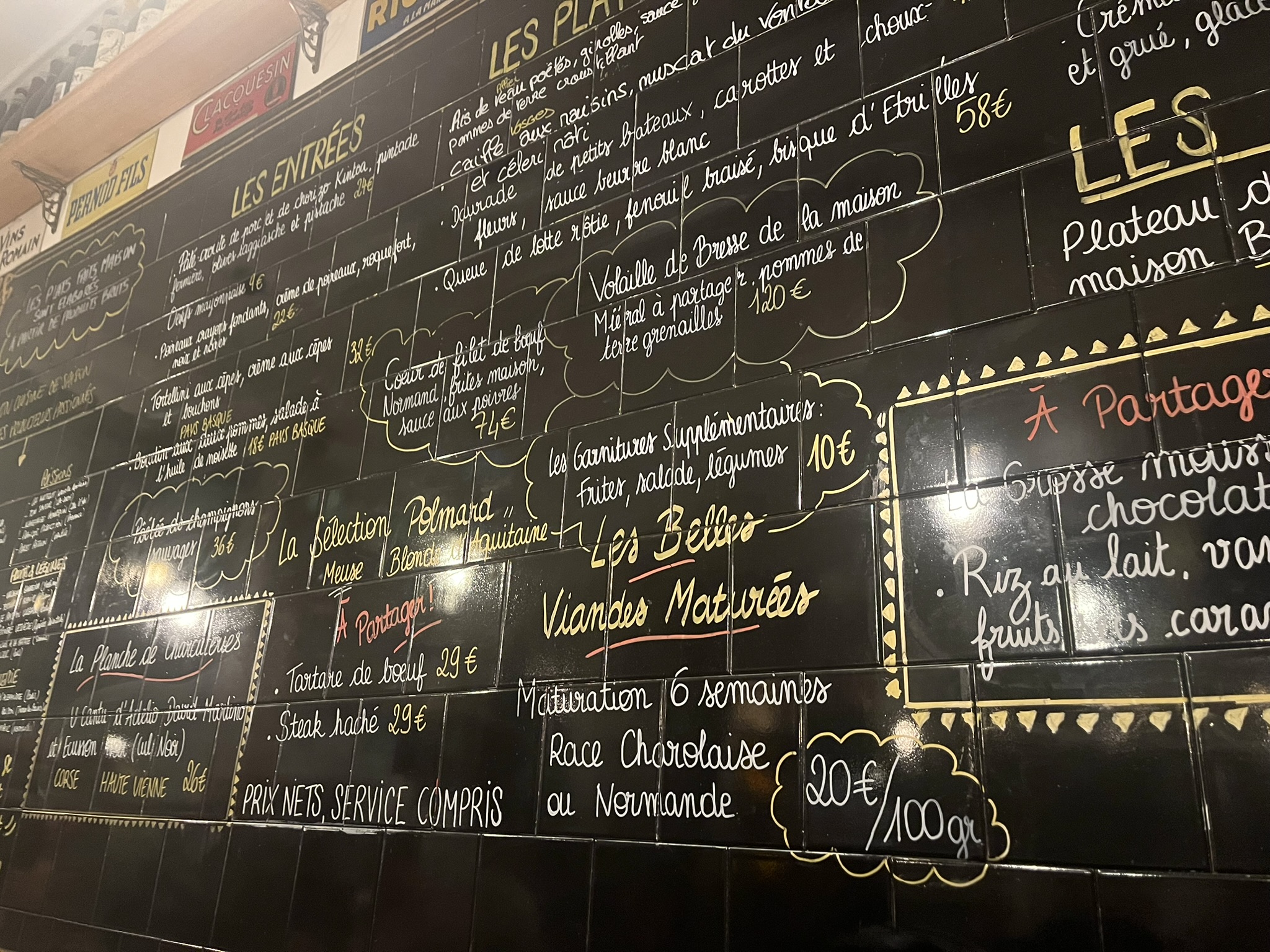 a menu board in a Paris bistro