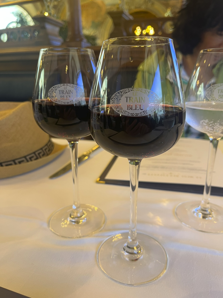 two glasses of red wine at Le Train Bleu restaurant Paris France