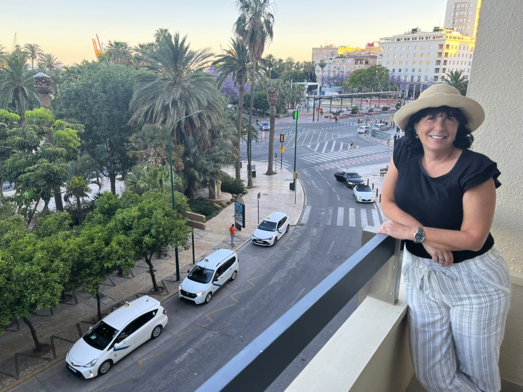 Sarah Alexander on balcony of suite at AC Hotel Malaga Palacio in Malaga Spain