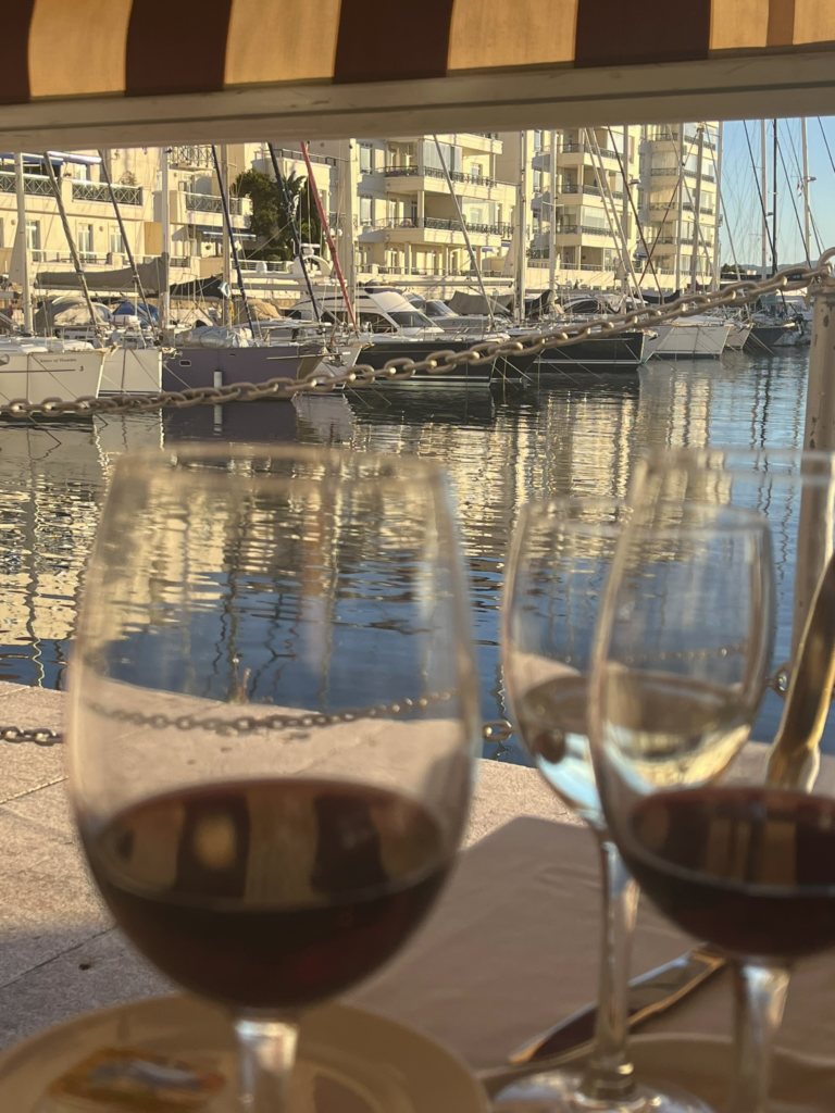 Gibraltar marina with glasses of wine