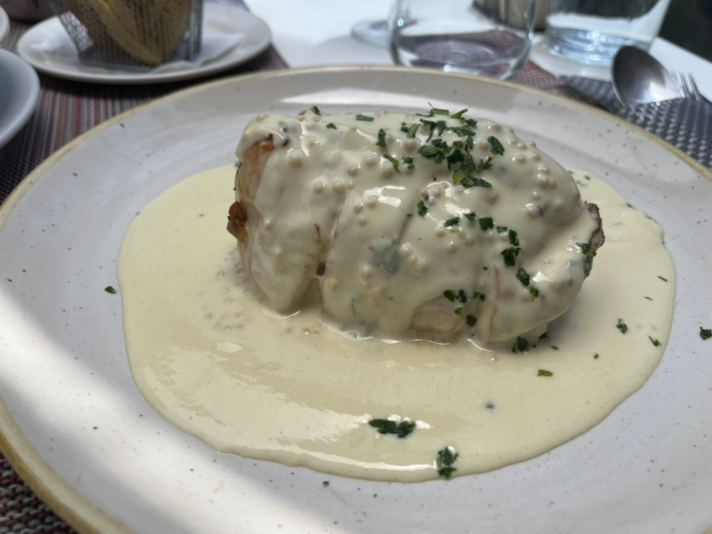 chestnut-and-sausage-stuffed roasted chicken breast with Dijon mustard cream sauce at Sabores do Curral restaurant, Curral das Freiras, Madeira