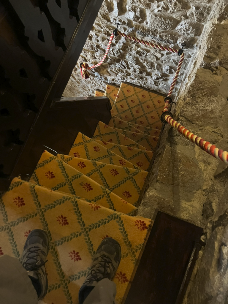 Looking down the steps from the tower room at Pousada do Costelo de Obidos Hotel in Obidos Portugal